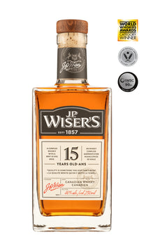 J.P. Wiser’s 15 Year Old Canadian Whisky 750ml bottle on a white background, featuring a clear glass design with a wood and cork cap and a refined cream, black and gold label. The label highlights the 15-year aging and Canadian whisky branding. The whisky inside has a deep amber hue. Aged Canadian whisky crafted in Ontario with smooth notes of spiced toffee, caramel, dried fruit, and a peppery finish—ideal for sipping neat or on the rocks.