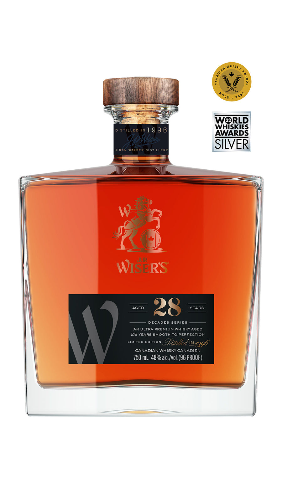 J.P. Wiser’s 28 Year Old Canadian Whisky 750ml bottle on a white background, featuring a clear glass bottle with a wooden cap and a premium black and gold-accented label. The label highlights the 28-year aging and Canadian whisky branding. The whisky inside has a deep golden hue. A rare, collectible Canadian whisky crafted in Ontario, celebrating the spirit of the 1990s with notes of fragrant honey, delicate fruit, and wholesome rye.
